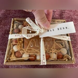 Rae Dunn peach-colored “Welcome” beaded garland.